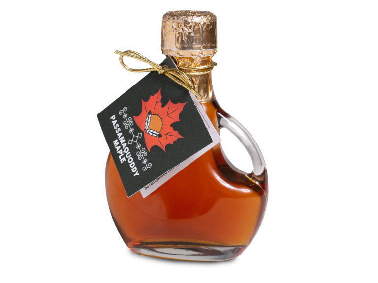 bottle of passamaquoddy maple syrup with white background