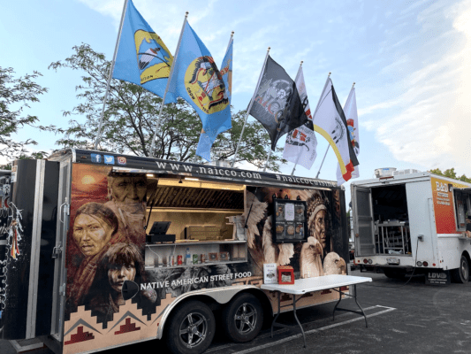 photo of the NAICCO food truck with Native designs and Tribal Nation flags
