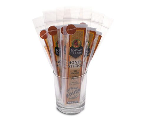 clear jar with Ioway Bee Farm honey sticks inside