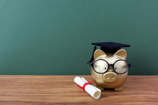 Green chalkboard background with gold piggy bank wearing glasses and graduation cap and small white diploma