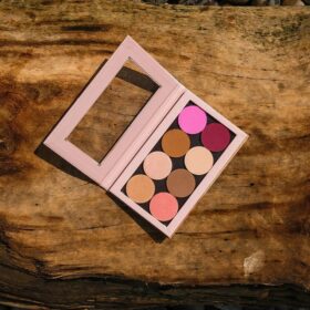 Makeup palette open on a wooden table
