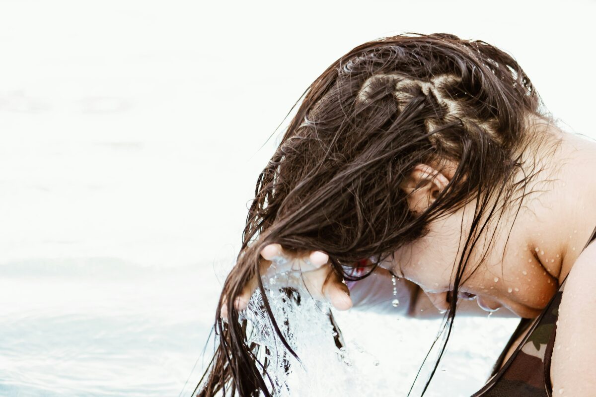 woman washing long brown hair